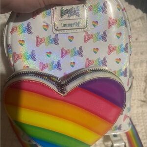 This is a Lisa Frank Loungefly. only used a couple times just don’t use it